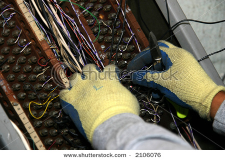 File:Stock-photo-mechanic-connecting-telephone-wires-into-old-telephone-terminal-2106076.jpg